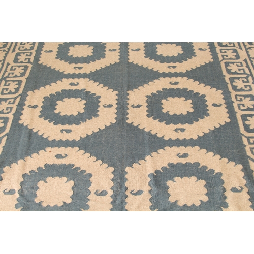 An OKA Chelak flatweave wool rug - in indigo blue and natural colourway ...
