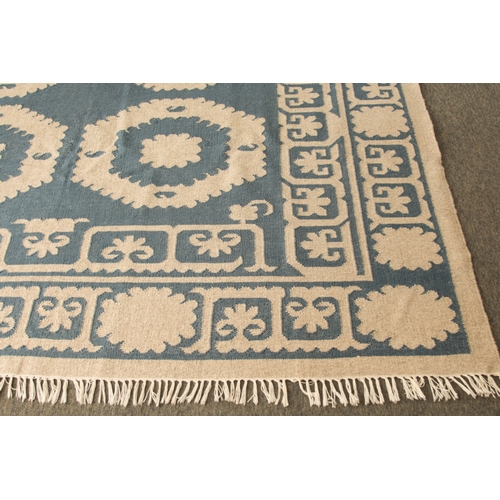 An OKA Chelak flatweave wool rug - in indigo blue and natural colourway ...