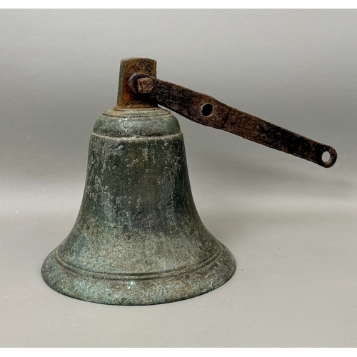 A 19th century cast bronze bell with an iron bracket, clapper missing ...