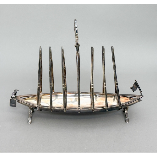 A Victorian silver plated novelty toast rack in the form of a rowing ...