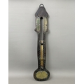 An antique carved oak wall hanging water clock - applied with brass ...