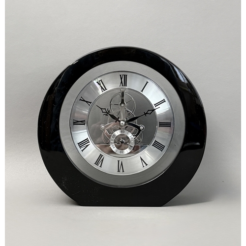 A skeleton gear desk clock - or timepiece, of circular form, black ...