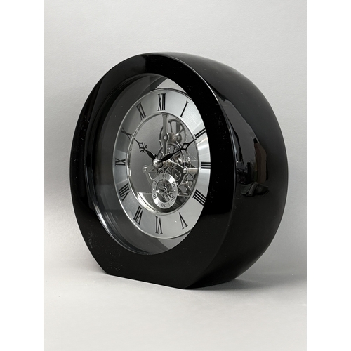 A skeleton gear desk clock - or timepiece, of circular form, black ...