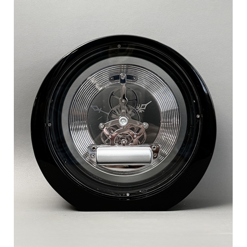 A skeleton gear desk clock - or timepiece, of circular form, black ...