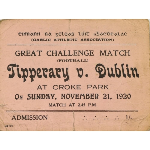 A Dark Day in GAA & Irish History 'Bloody Sunday' Ticket An original Admission Ticket to Croke Park, Great Challenge Match (Football), Tipperary v. Dublin, Sunday November 21,1920. Pink card, 3 ins x 4 ¼ ins, vertical fold mark with slight tear, number written rear in ms. It was at this match that British soldiers opened fire on the pitch and crowd, killing a player and twelve spectators. This followed Michael Collins' operation against British secret service agents earlier that morning, in which fourteen British officers were shot dead. (1) The period 1918 - 1920 was a turbulent and dangerous period in Irish History. Martial Law was enforced in many areas, and the activities of the G.A.A. and other Sporting Organisations were severely curtailed. The behaviour of the British Forces in Ireland forced many young men to join the Irish Volunteers, and other Republican Organizations despite having no background in the movement. Especially in Tipperary, many young men of the time, and particularly those involved in Gaelic Games joined in the struggle for Irish Independence. With such exciting events as the Rescue of Sean Hogan at Knocklong Railway Station in May 1919, several of the country's leading Footballers became involved in the War of Independence. By early March 1920 the number of Gaelic Games played almost came to a standstill. This trend continued into the early summer when normally the volume of activity should have been increasing. In October there came a sudden and brief revival of Inter-County Fixtures. However, the following month was to have a tragic outcome. In early October, approximately five thousand spectators who had so far that year had little exciting fare were entertained by a rousing Challenge Football Match in Croke Park, between Dublin and Kildare, which Dublin won. Soon afterwards, the Tipperary County Board issued a challenge to Dublin. A match was arranged for 2.45 p.m. on Sunday November 21st, again at Croke Park. The game was well organised, and advertised as The G.A.A. Challenge Match. It was intended that the money raised from the match would help the Association for the Dependents of the I.R.A. who had been killed or imprisoned. The events which occurred at that game, now known as ''Bloody Sunday,'' followed the early morning assassination of eleven British Intelligence Agents, ''The Cairo Gang,'' in an operation organized by Michael Collins. When the British retaliated later that day, it was to Croke Park that the Military and Auxiliary Forces came, recognizing that the Stadium was the centre and symbol of Irish Nationalism and Nationalistic Aspirations. ''Then suddenly and without any warning, Croke Park was the scene of a holocaust??'' They fired into the crowd indiscriminately, killing twelve people and wounding about sixty, ''On the field Michael Hogan, one of the Tipperary backs (and one of only two Irish Volunteer Officers on the Tipperary Team) lay mortally wounded, while within seconds a dozen spectators were dead or dying, many more seriously wounded.'' This was Bloody Sunday. Nothing more strikingly illustrates the close connections between the G.A.A. and the Republican Movement between 1916 and 1922, than ''Bloody Sunday.'' (1)