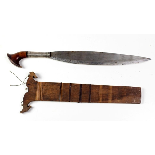 473 - An early 19th Century shaped heavy steel Middle Eastern Short Sword, with silver and shaped wooden h... 