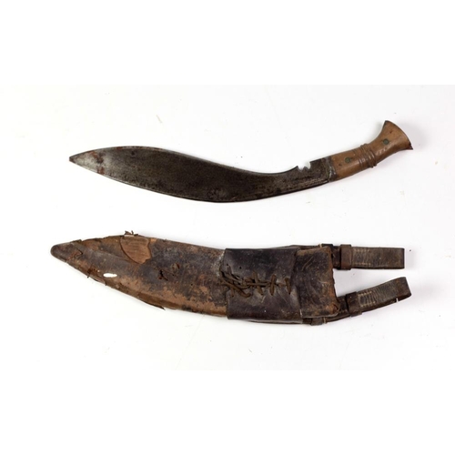 486 - An early 20th Century Kurkha, with shaped blade stamped 1915, with wooden handle and scabbard. (1)... 