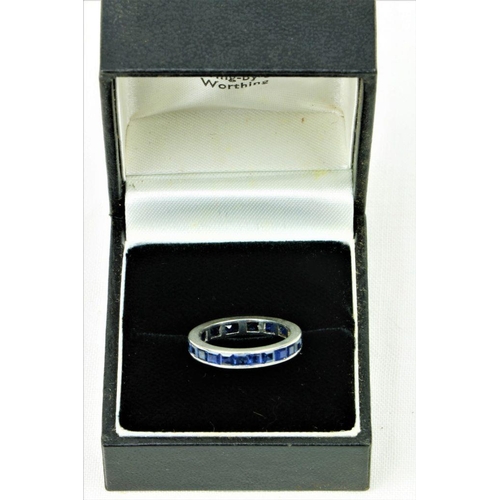 514 - A Channel Set platinum Eternity sapphire Ring, set with .06 x 15 = 1.5 tcw, size J. (1)... 