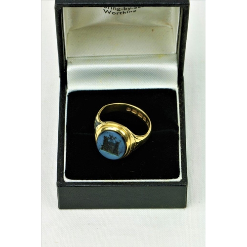 517 - A Gentleman's 18ct gold blue onyx Seal Ring, with central turreted castle gates 