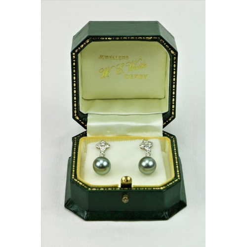 520 - A fine quality pair of Tahitian pearl and diamond drop Ear-Rings, set with .28ct G/Si round diamonds... 