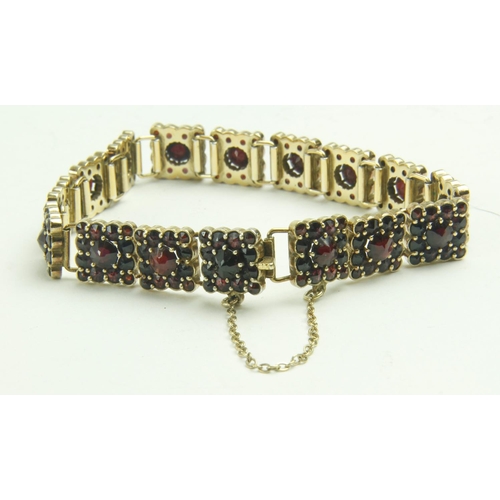 534 - A Ladies gold plated silver Bracelet, of link design with attractive ruby type pyramid shaped garnet... 