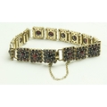 A Ladies gold plated silver Bracelet, of link design with attractive ruby type pyramid shaped garnet... 
