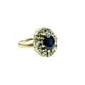 An attractive Ladies oval shaped Ring, with large centre sapphire surrounded by small inset diamonds... 
