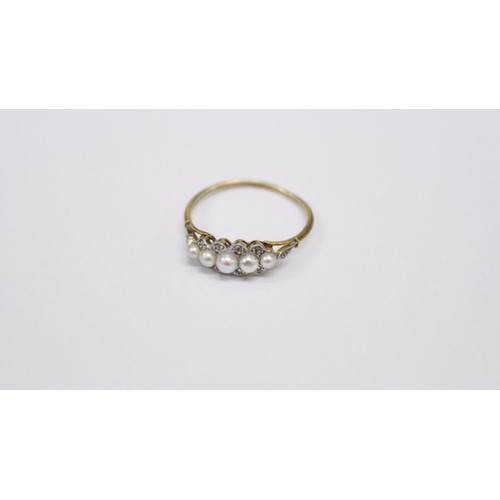 512 - An 18ct gold Ring, with five graduating pearls, set with .1ct of diamond chips, size L 1/2. (1)... 