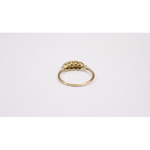 512 - An 18ct gold Ring, with five graduating pearls, set with .1ct of diamond chips, size L 1/2. (1)... 