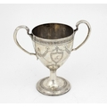 An early 19th Century Irish silver crested two handled Cup, with bright cut decoration in the Adams ... 