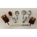 A matching set of silver Brushes & Mirrors, some in leather cases, and a long ivory Letter Opene... 