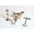 A pair of small Birmingham silver Sauceboats, a pair of modern Birmingham silver Bachelor Candlestic... 