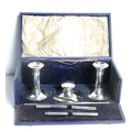 A Victorian silver Stationery Set, in original box, comprising inkwell, two candlesticks and pen. (1... 