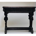 A 19th Century Cromwellian style carved oak Hall Table, of low proportions, the shaped top over a ca... 