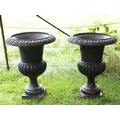 A pair of Victorian cast iron Urns, with egg n' dart moulded rims, on circular bases, each approx. 7... 