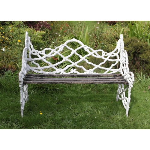 26 - A Victorian period Gothic style cast iron Garden Bench, modelled as interwoven branches, with latted... 
