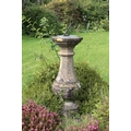 A 19th Century carved bulbous shaped octagonal pillar Sundial, with slate and steel dial on top, app... 