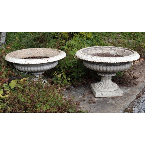 32 - A pair of Victorian cast iron Garden Urns, with egg n' dart moulded rim, on square plinth base, each... 