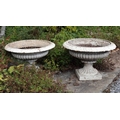 A pair of Victorian cast iron Garden Urns, with egg n' dart moulded rim, on square plinth base, each... 