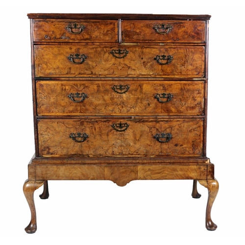 323 - A fine quality 19th Century walnut Chest, of two short and three long drawers on stand, the segmente... 