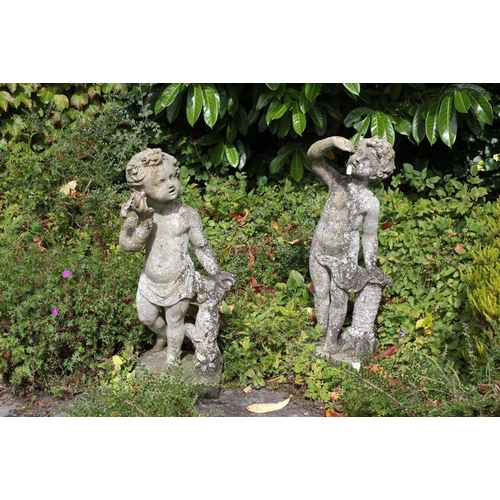 33 - Two Victorian style composition Statues of young Children, depicting a young boy listening to a shel... 