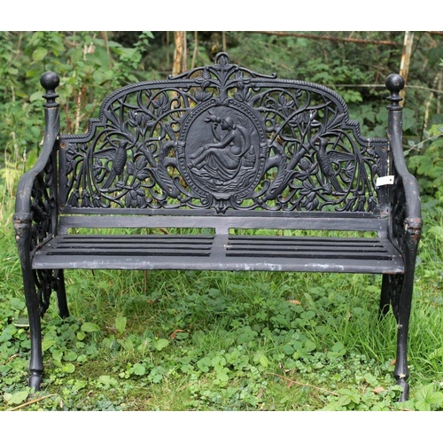 36 - A pair of Victorian style pierced and decorated cast iron Garden Benches, each with medallion backs ... 