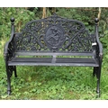 A pair of Victorian style pierced and decorated cast iron Garden Benches, each with medallion backs ... 