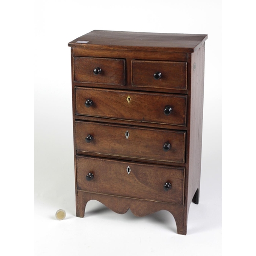 434 - A late Georgian mahogany Chest, of two short and three long drawers with wooden knobs and mother-o-p... 