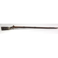 An early Victorian Colonial long barrel flintlock Rifle, with leather banding, shell decoration, sta... 