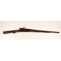 An antique Wheellock Rifle, dam; remains of a Flintlock Rifle, the stock and barrels of a double bar... 