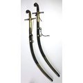 An early 19th Century Indian Sabre, in an engraved brass and animal skin scabbard, signed with stamp... 