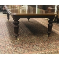 A fine quality Irish Victorian period mahogany extending Dining Table, in the manner of Strahan, the... 