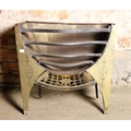 A small antique metal Fire Grate, with engraved brass sides, and pierced brass frieze, 56cms (22