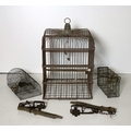 A Victorian wire Parrot's Cage, a variety of Rat Traps etc. A lot. (1)