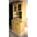 An old stripped two part Pine Dresser, with glass press on top, over drawers and panel doors below. ... 