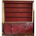 A very large antique pine Dresser, painted red, four shelf top, over three frieze drawers, and four ... 