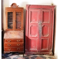 An antique painted pine two door Cupboard, with carved panels, and a modern mahogany Bureau Bookcase... 