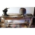 A large Milk Separator, on heavy metal floor stand, and a wooden Bench with two separators attached.... 