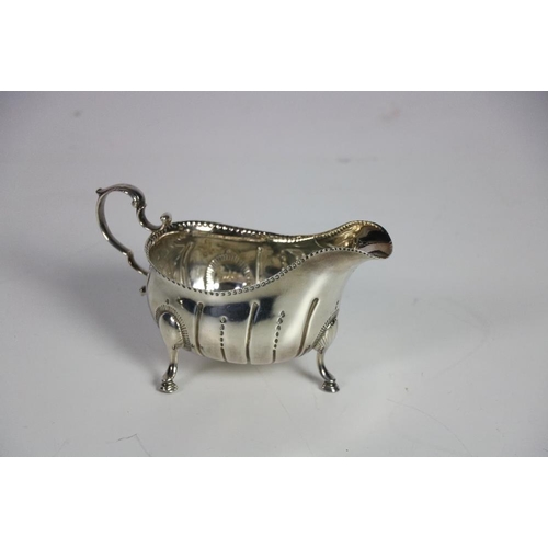 129 - A good early George III 18th Century Irish silver Sauceboat, on three pad feet, Dublin c. 1767, poss... 