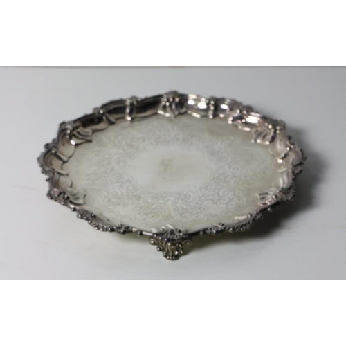 134 - A small Victorian Scottish silver Salver, with engraved body and shaped rim decorated with scrolls a... 
