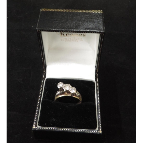 149 - An Art Deco 18ct gold Ring, with three solitaire diamonds set high, flanked by two engraved bands, h... 