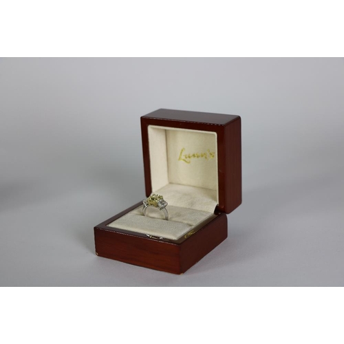 157 - An exquisite 3 stone diamond Ring, by Lunns of Belfast, with 2.93ct fancy intense yellow centre ston... 