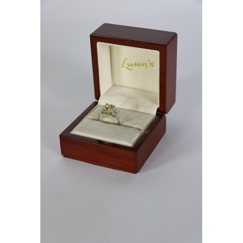 157 - An exquisite 3 stone diamond Ring, by Lunns of Belfast, with 2.93ct fancy intense yellow centre ston... 