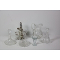 Cutglass: A large cutglass Water Ewer, cutglass Decanters, large vase, and other glass items. As a l... 